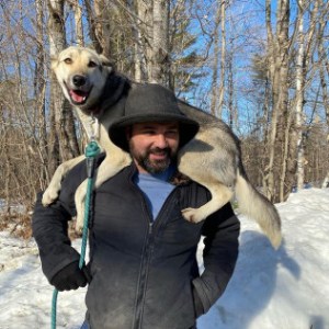 a couple of people that are standing in the snow