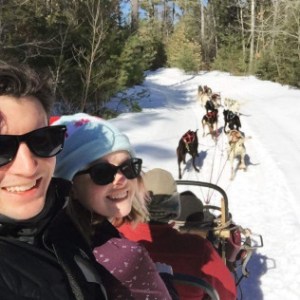 a couple of people that are standing in the snow