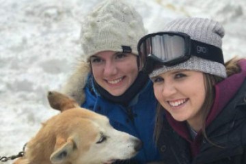 a person and a dog posing for the camera