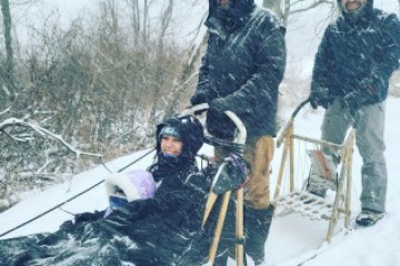 a group of people that are standing in the snow