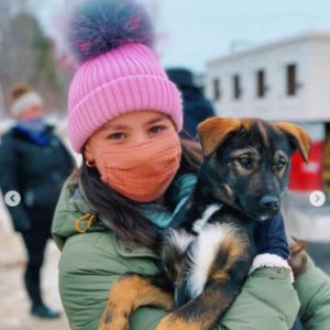 a person holding a dog