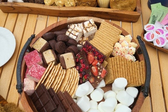 a bunch of food sitting on top of a wooden table