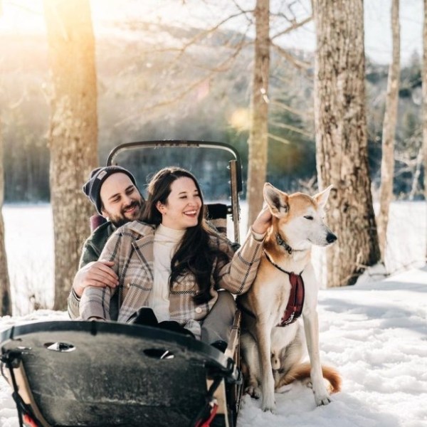 a couple of people that are standing in the snow