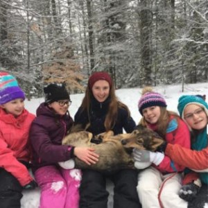 a group of people posing for a picture in the snow