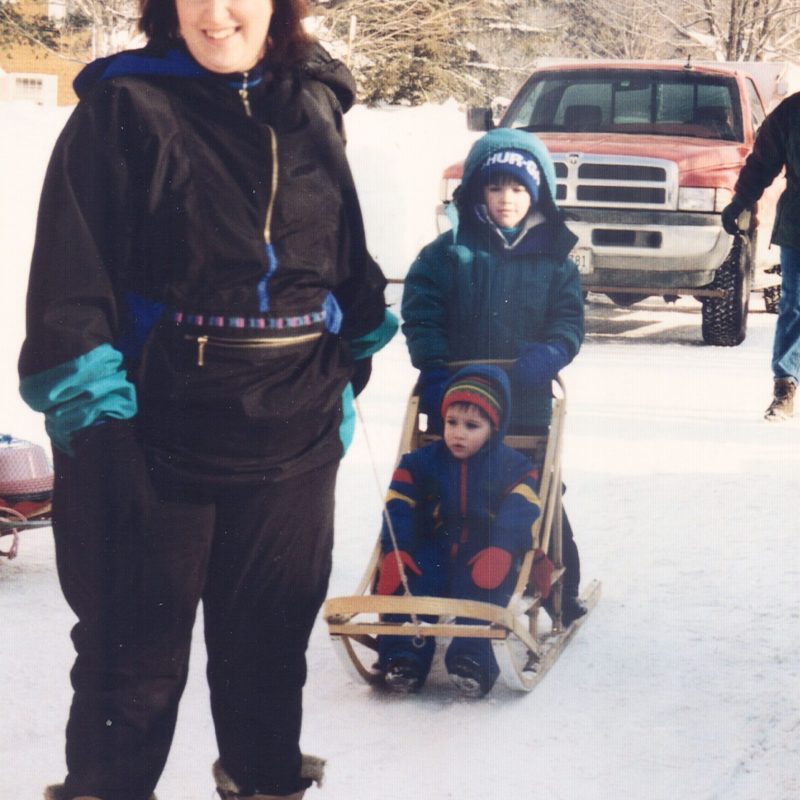 a couple of people that are standing in the snow