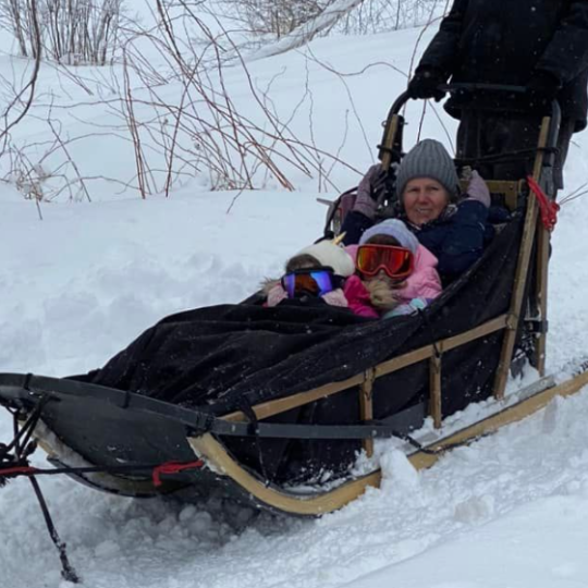 a person sitting on a pile of snow