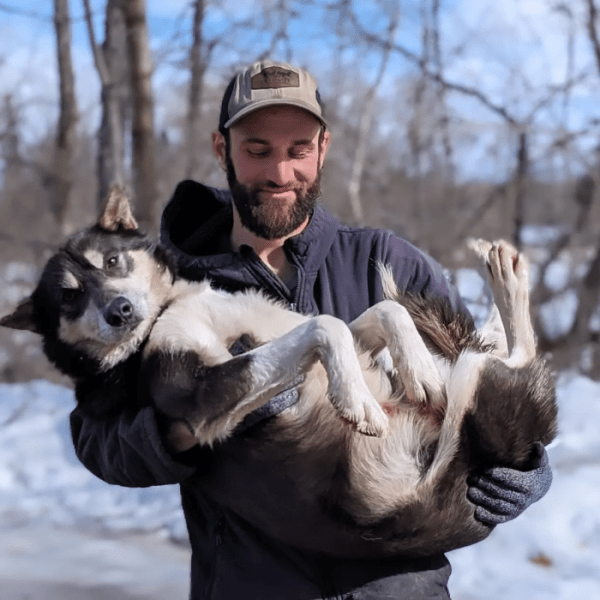 a person holding a dog