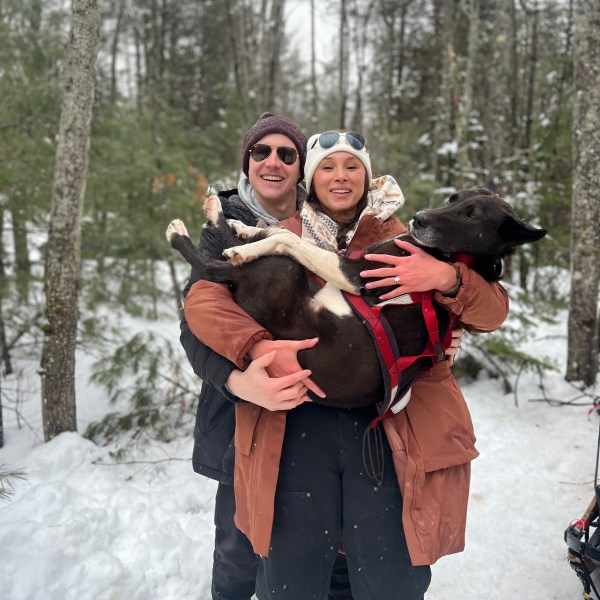 a man and a woman standing in the snow